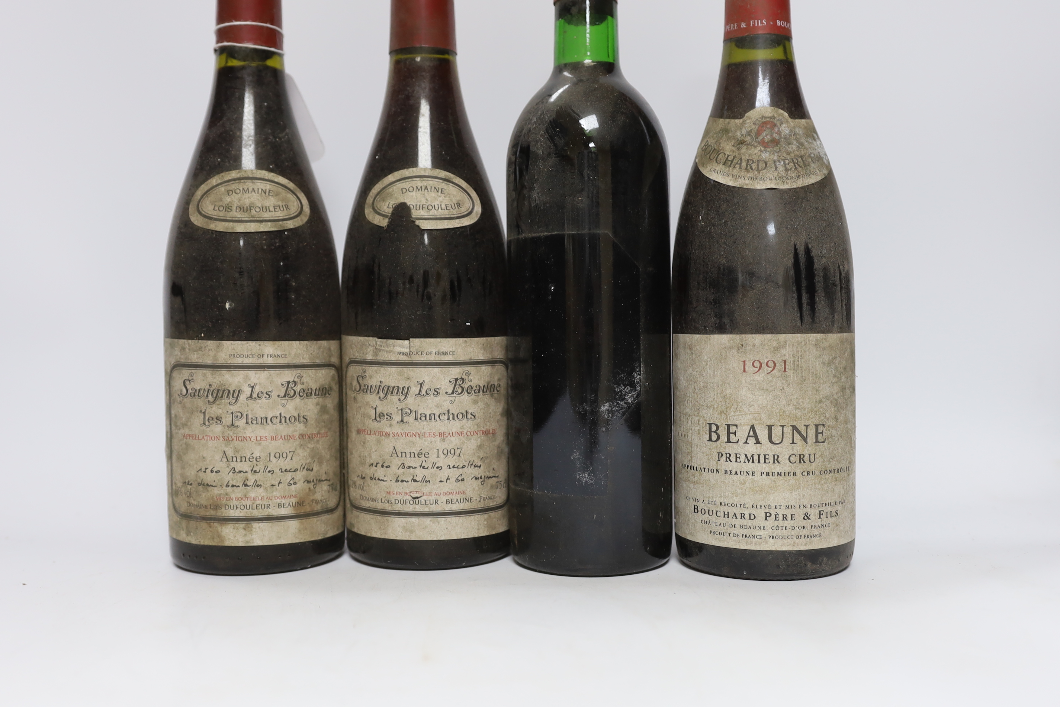 Six bottles of red wine including two bottles of Savigny Les Beaune 1997